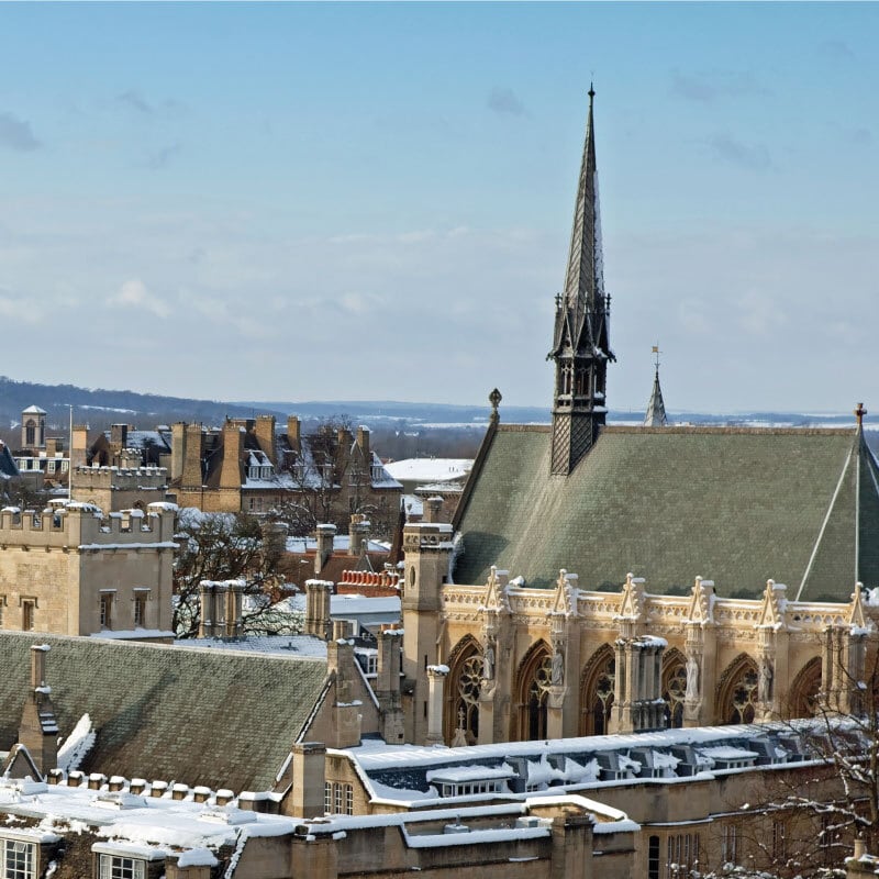 Image of Oxford college rooftops in the snow
